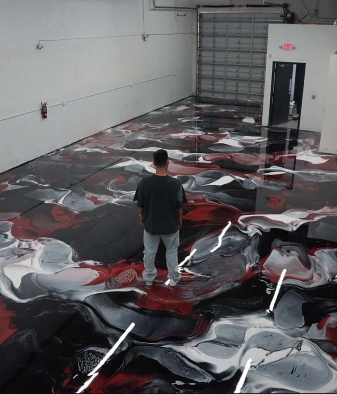 Metallic black and red epoxy floor in a Dubai warehouse