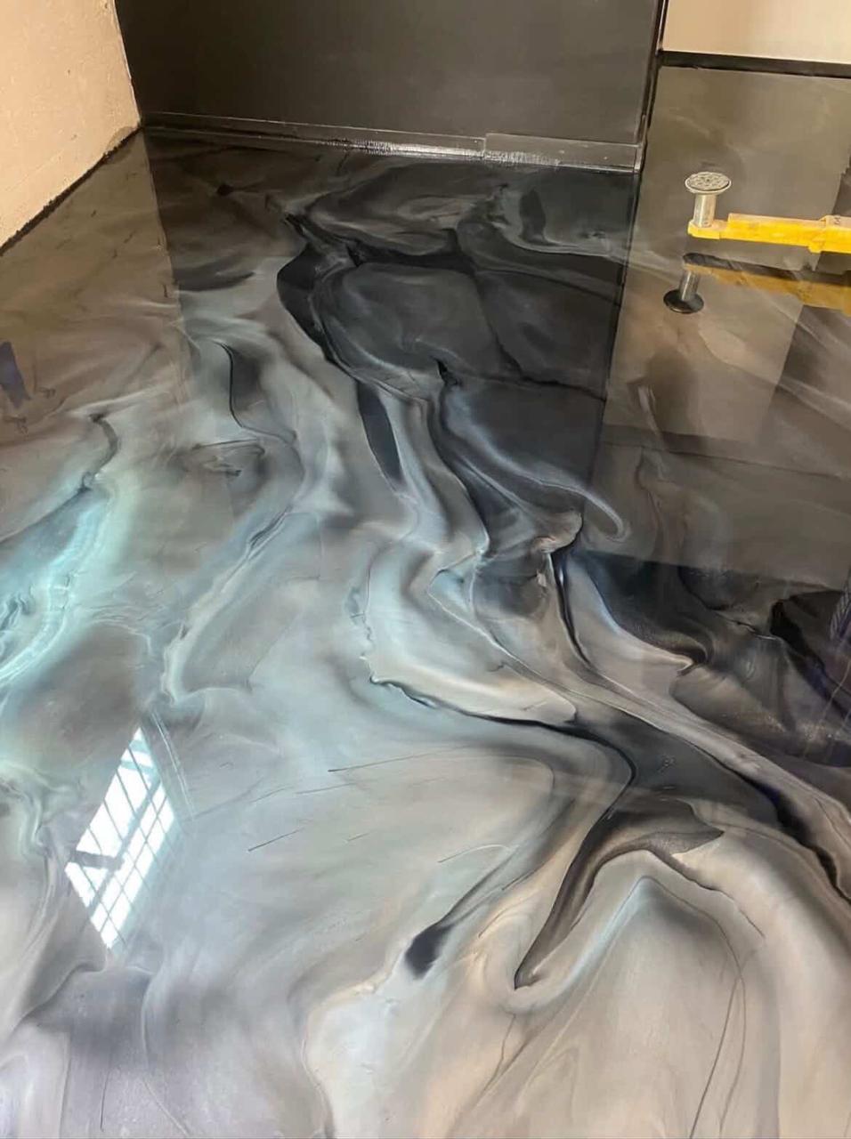 Blue and silver metallic epoxy floor in a residential space